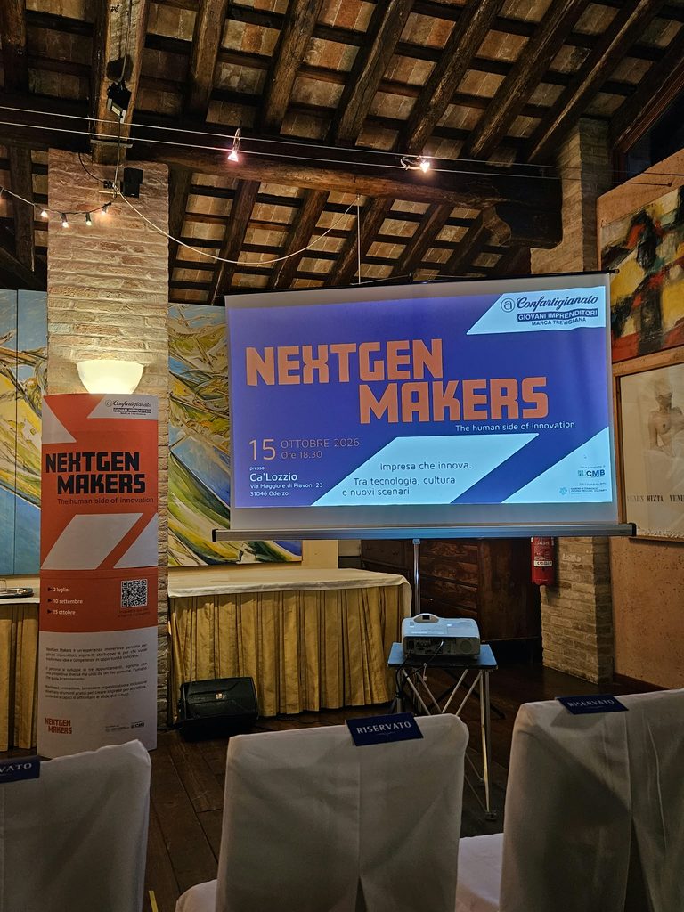 Schermo e sala convegni del terzo incontro di Nextgen Makers
